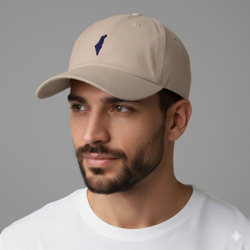Man wearing a beige cap with a logo on a gray background